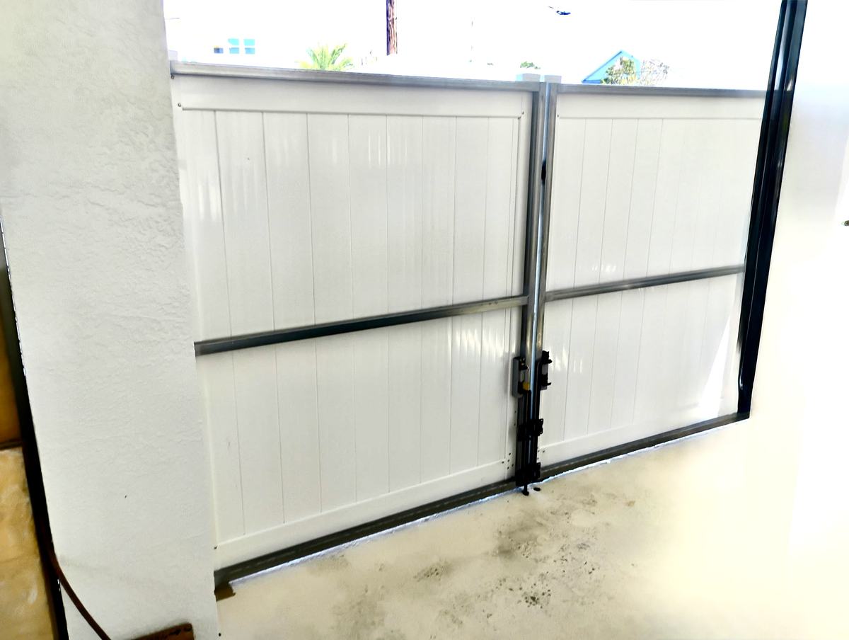 Inside view of a welded steel gate frame with white vinyl in Hernando Beach, FL