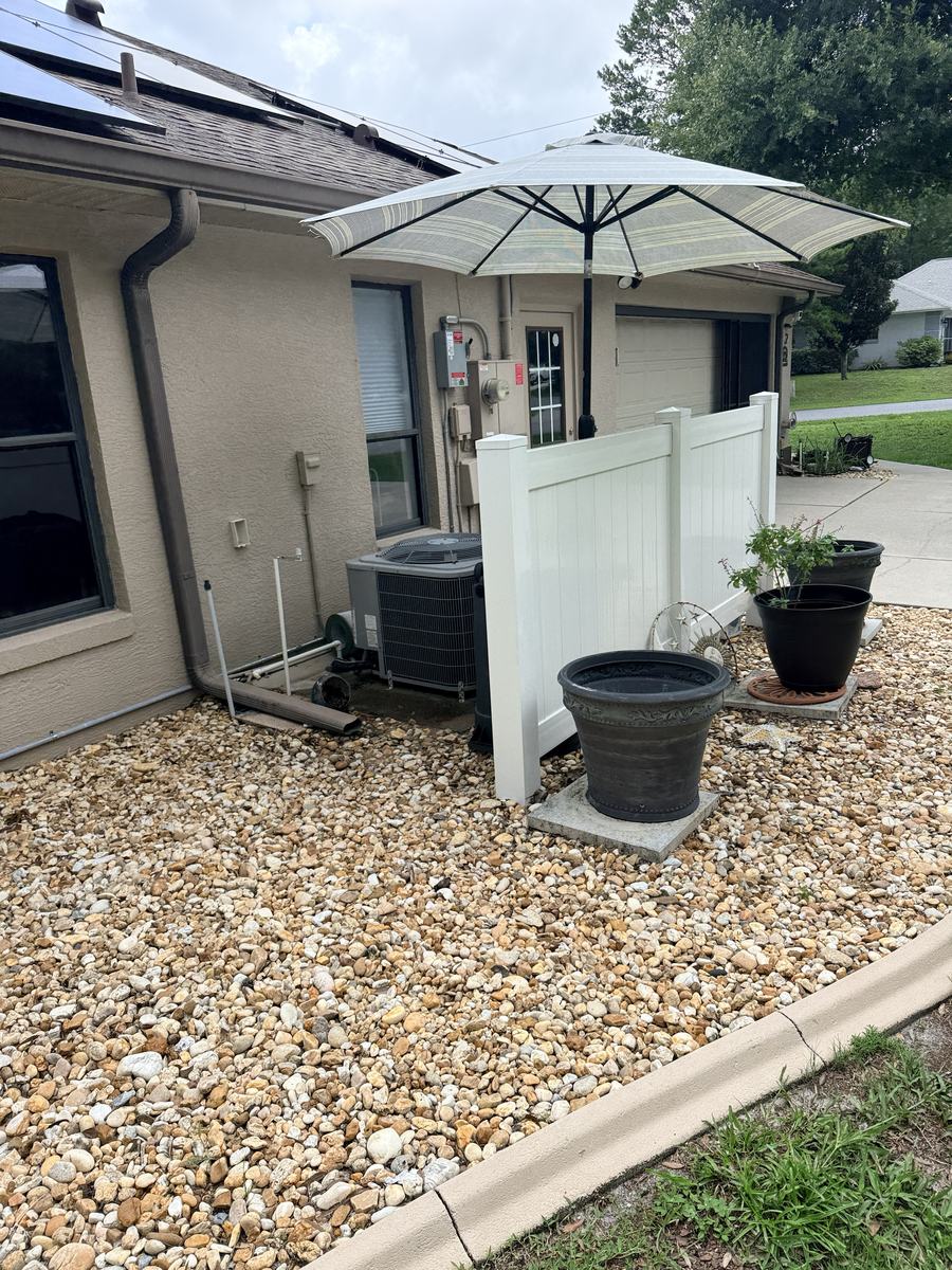 White vinyl privacy screen in front of an AC unit in Hernando County, FL