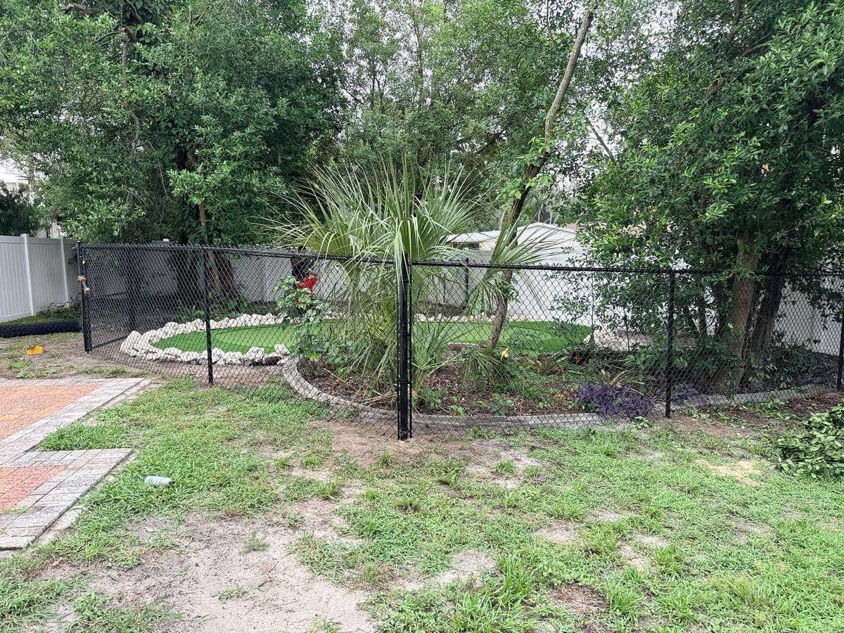 5 ft black chain link fence around landscaping in Spring Hill, FL