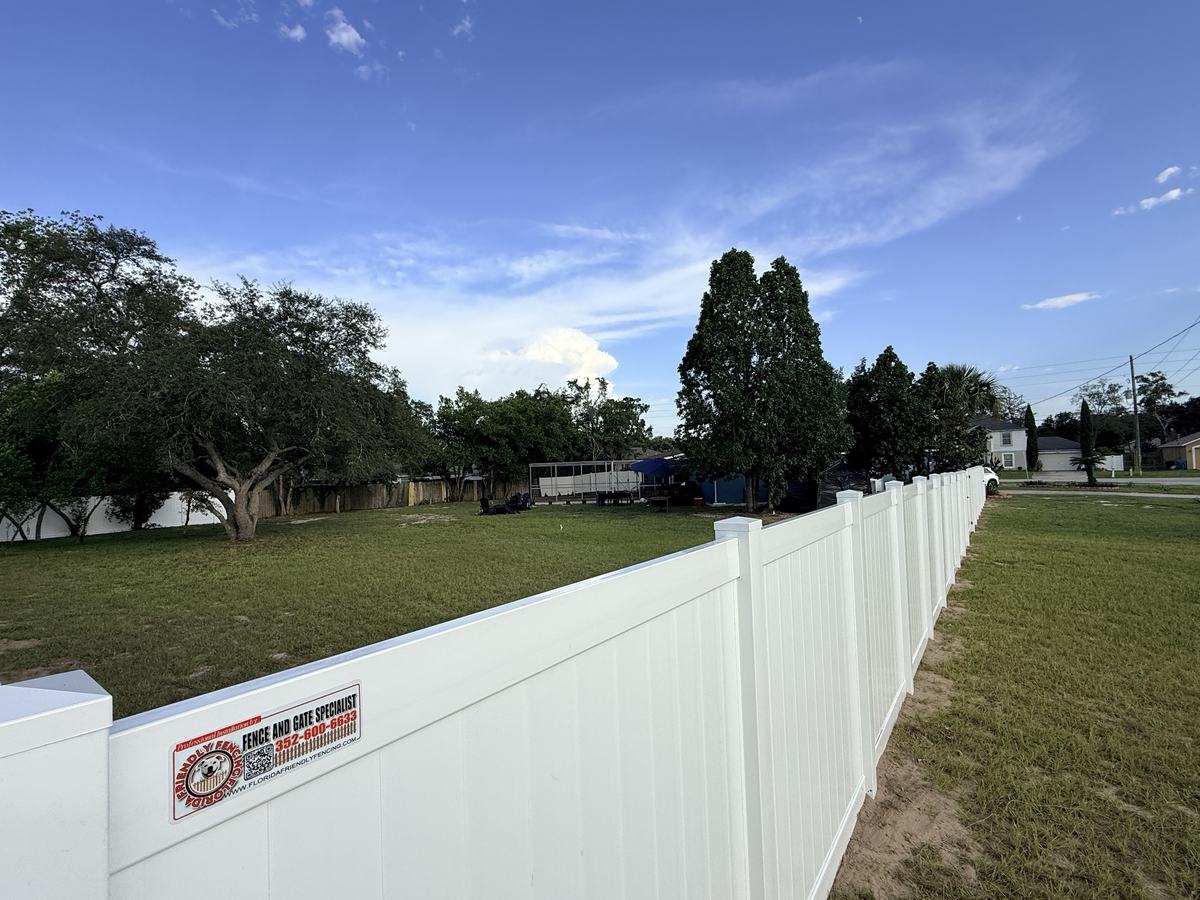 Long white vinyl privacy fence on a Spring Hill corner lot