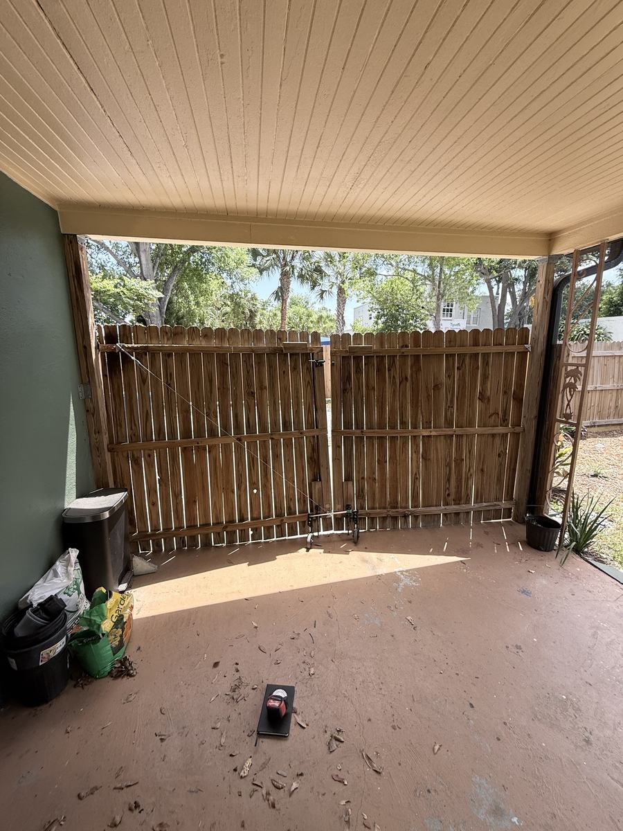 Before: old sagging wood carport gates in St. Petersburg, FL