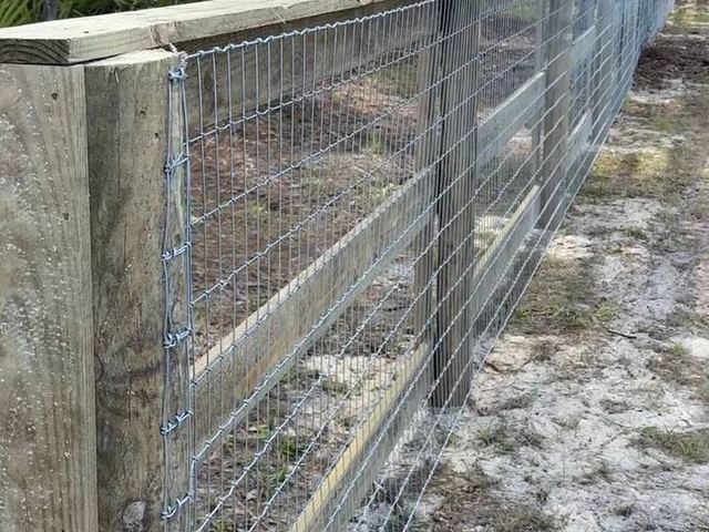 Ranch rail fence with no-climb wire in Weeki Wachee, FL